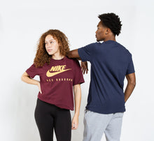 Load image into Gallery viewer, Two people wearing Nike t-shirts, one maroon with yellow logo and text, the other navy blue.