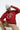 Person wearing a red 'Howard Community College' hoodie and gray beanie on a white background